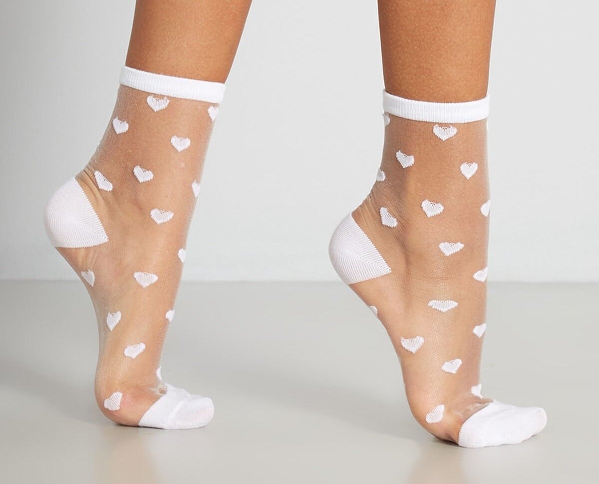Sheer heart socks being worn by model