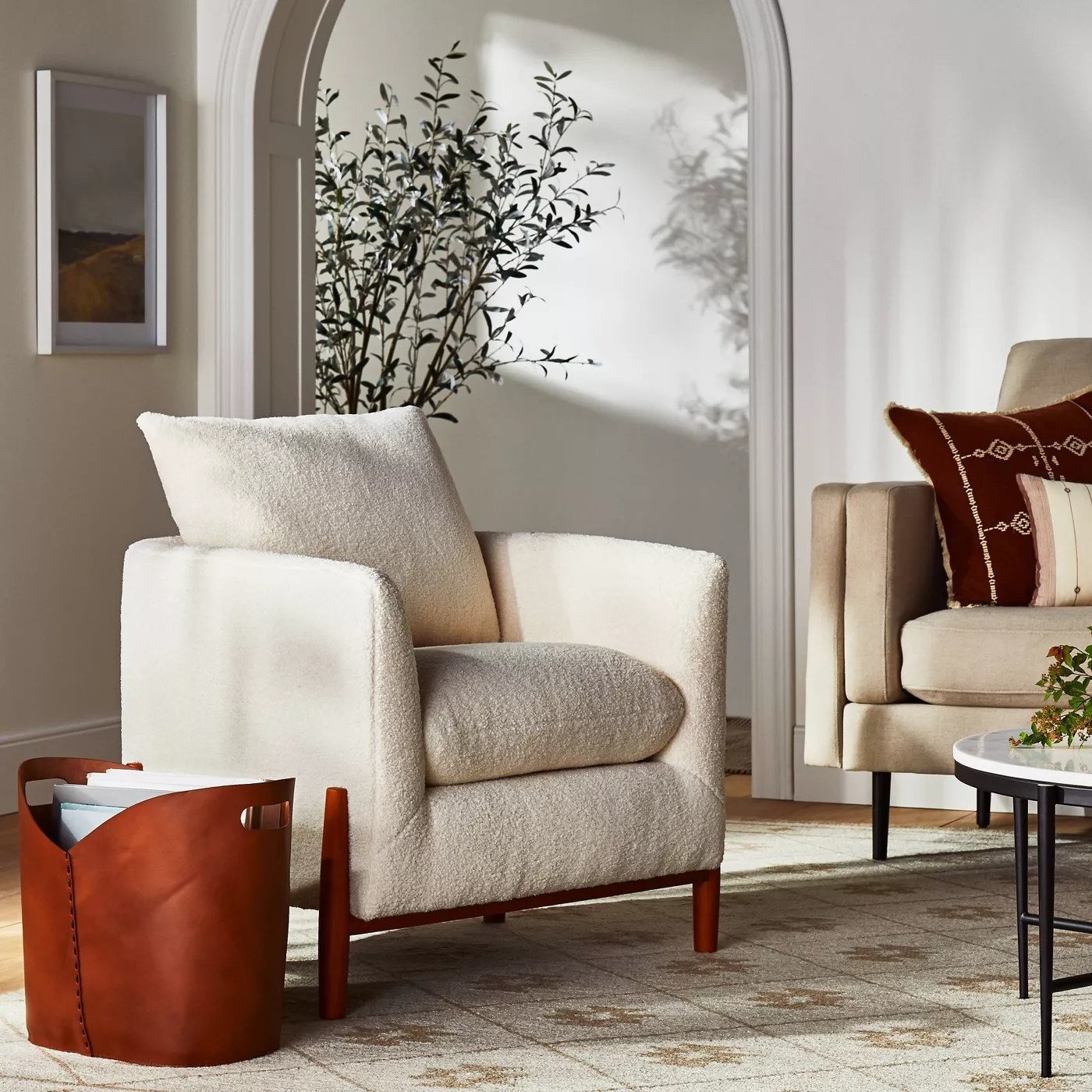 The cream sherpa accent chair with wooden legs