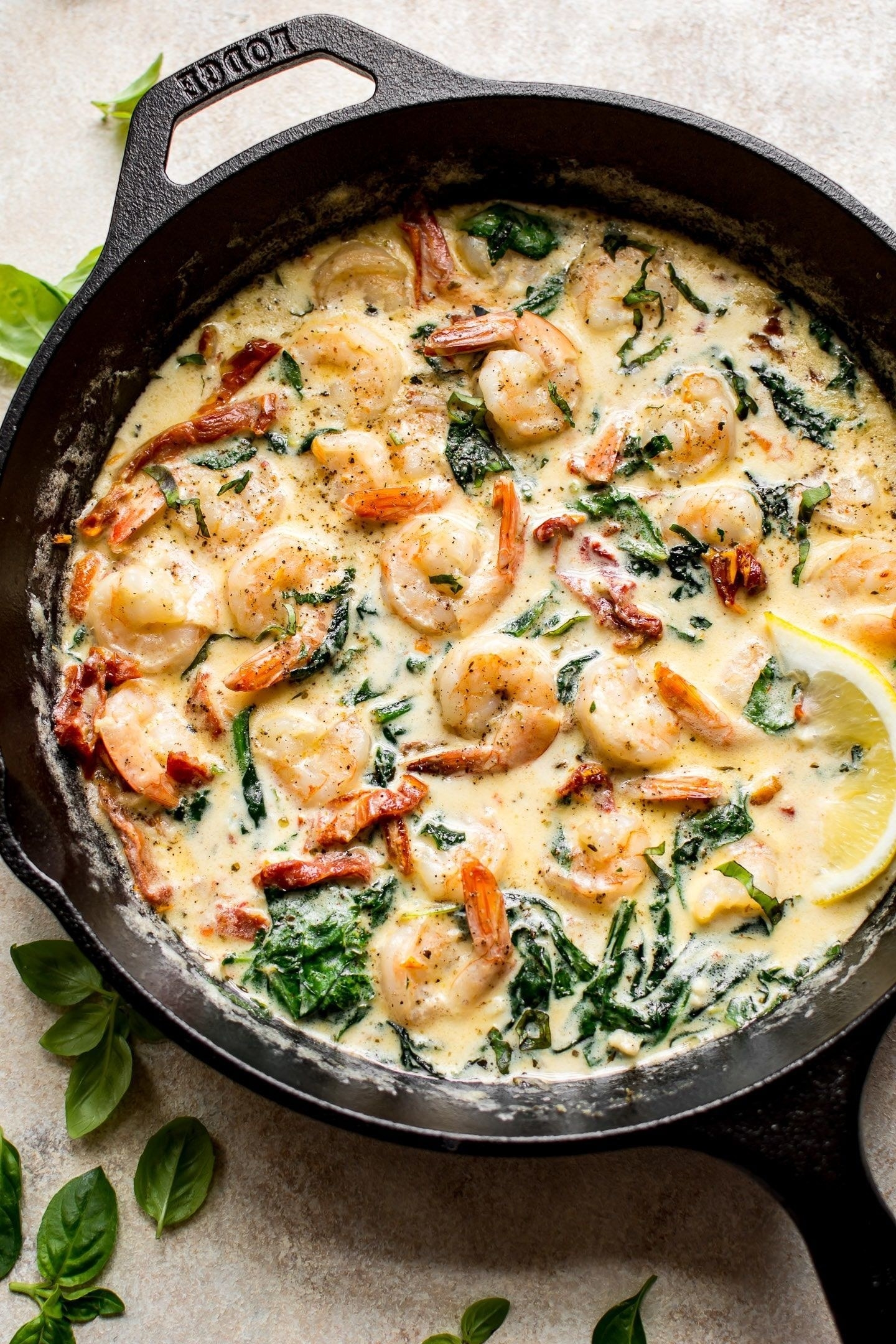 A skillet of creamy shrimp with spinach and sun-dried tomatoes