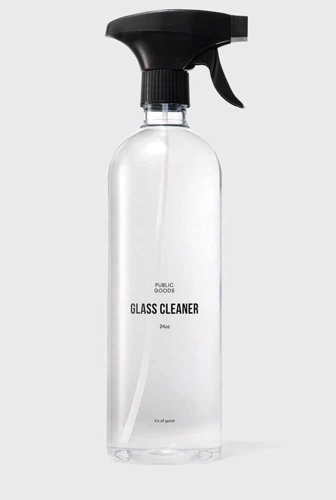 The bottle filled with the clear solution of glass cleaning spray