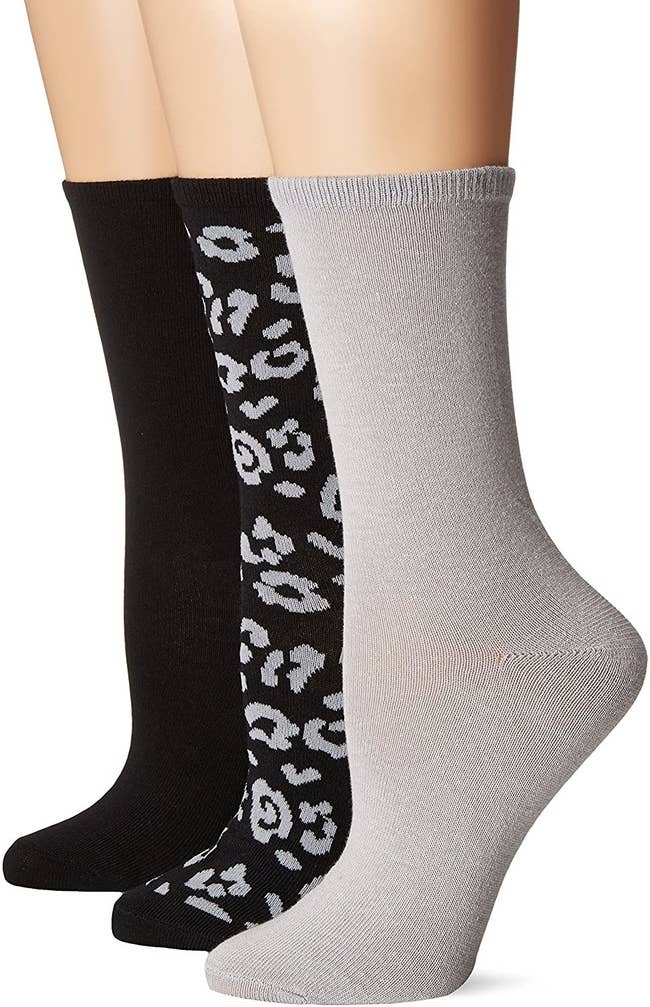 The black, leopard print, and gray socks in the pack