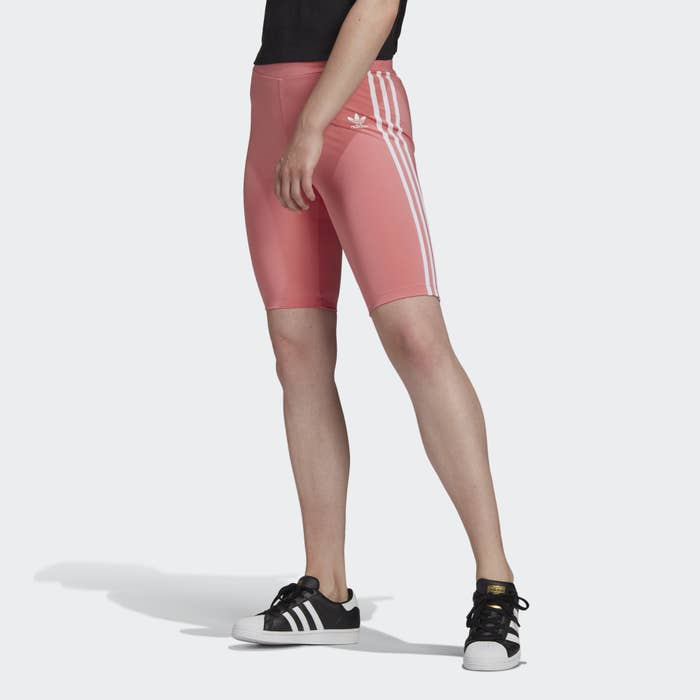 Model wearing pink tight shorts