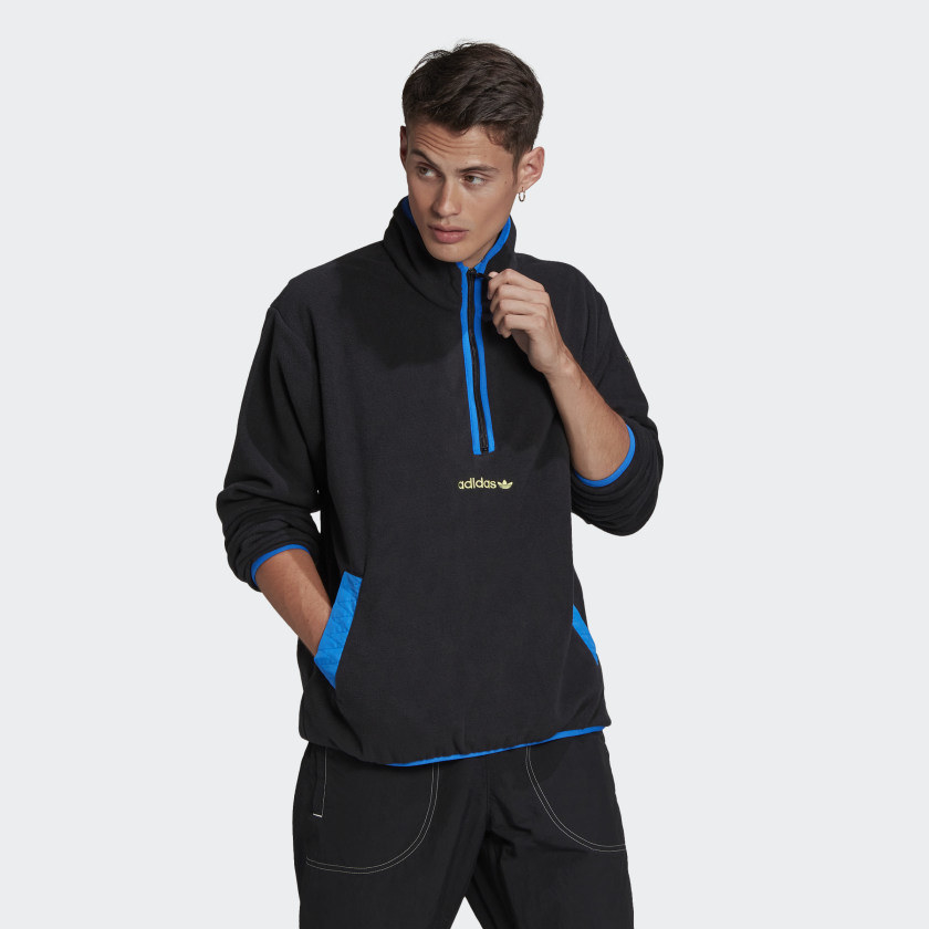 Model wearing blue zip up pullover