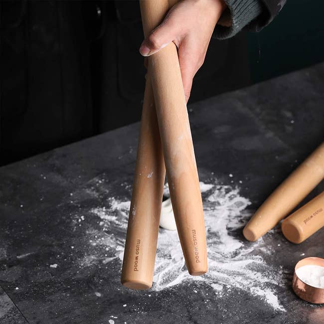 the two rolling pins in flour