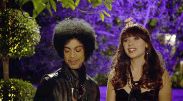 Prince tapping his shoulder and a butterfly landing on it in New Girl