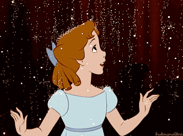a gif of wendy from peter pan being covered in sparkles