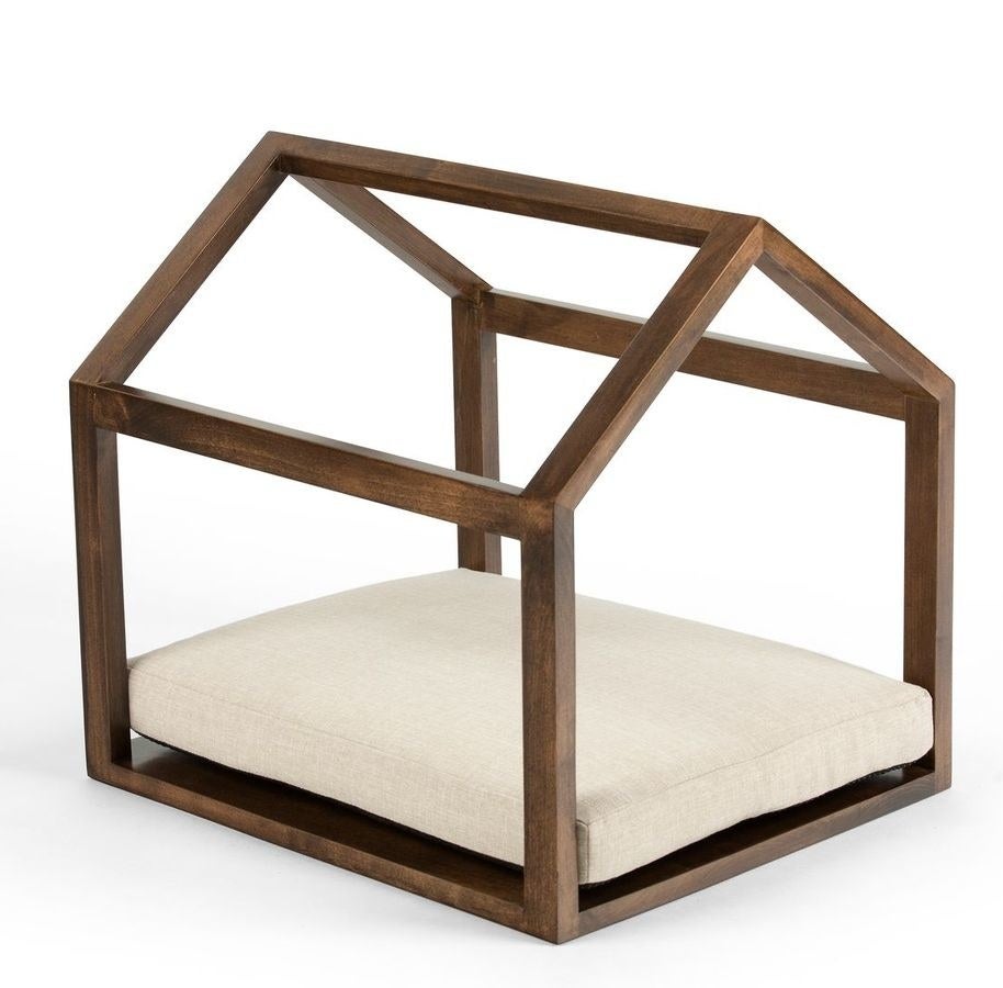 the pet cabana with hazel wood and a beige cushion