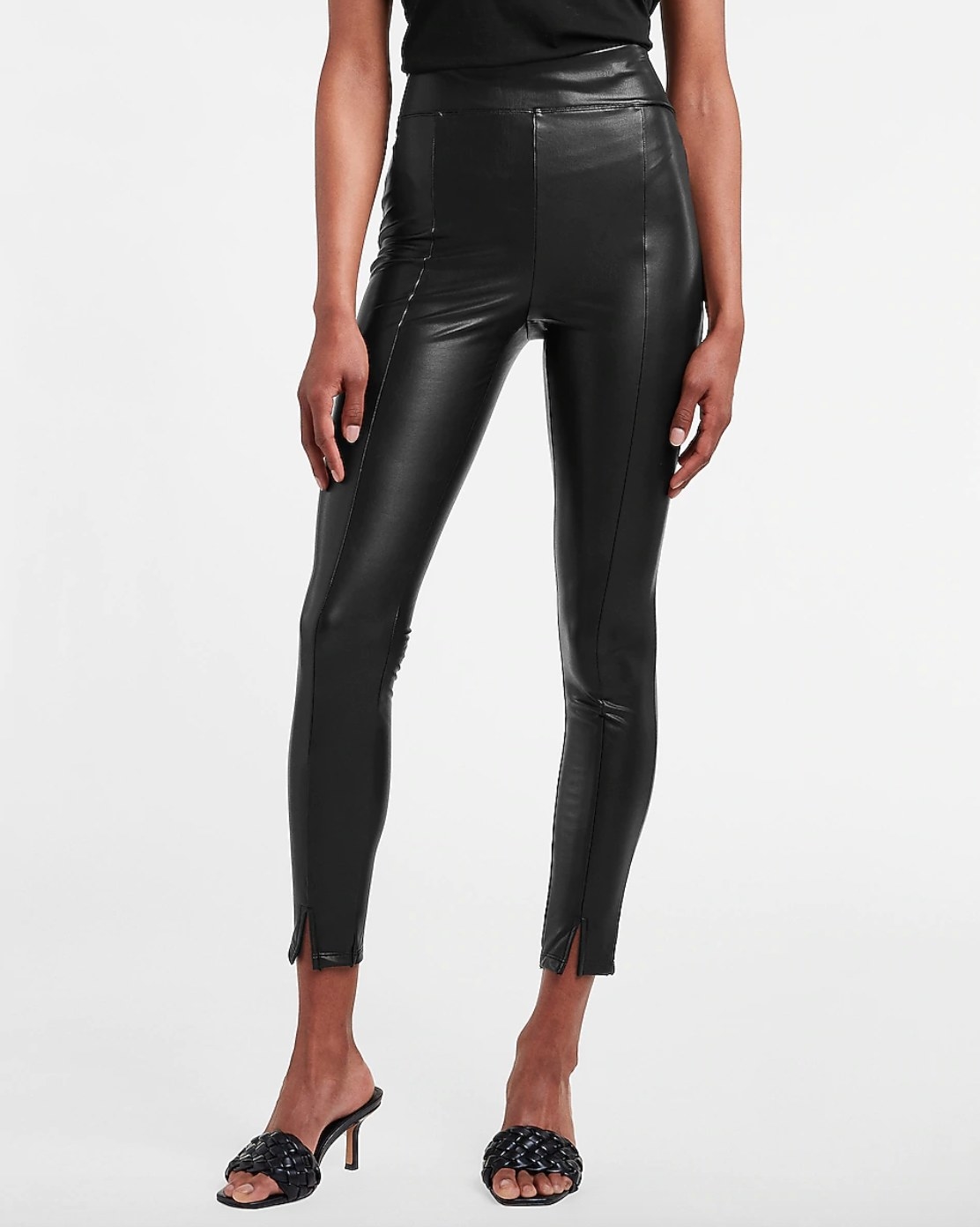 model wearing the pair of super high waisted vegan leather pants in black