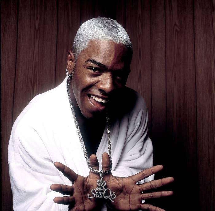 Sisqó posing and showing off his &quot;Sisqó&quot; chain