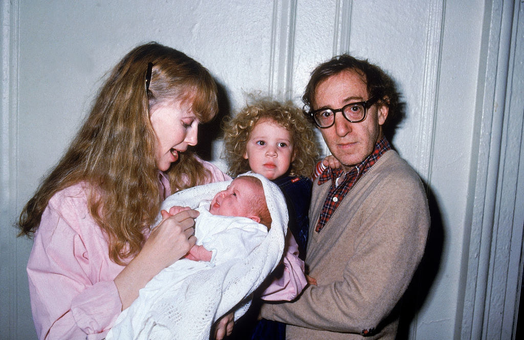 Mia Farrow holding baby Ronan while Woody is holding baby Dylan