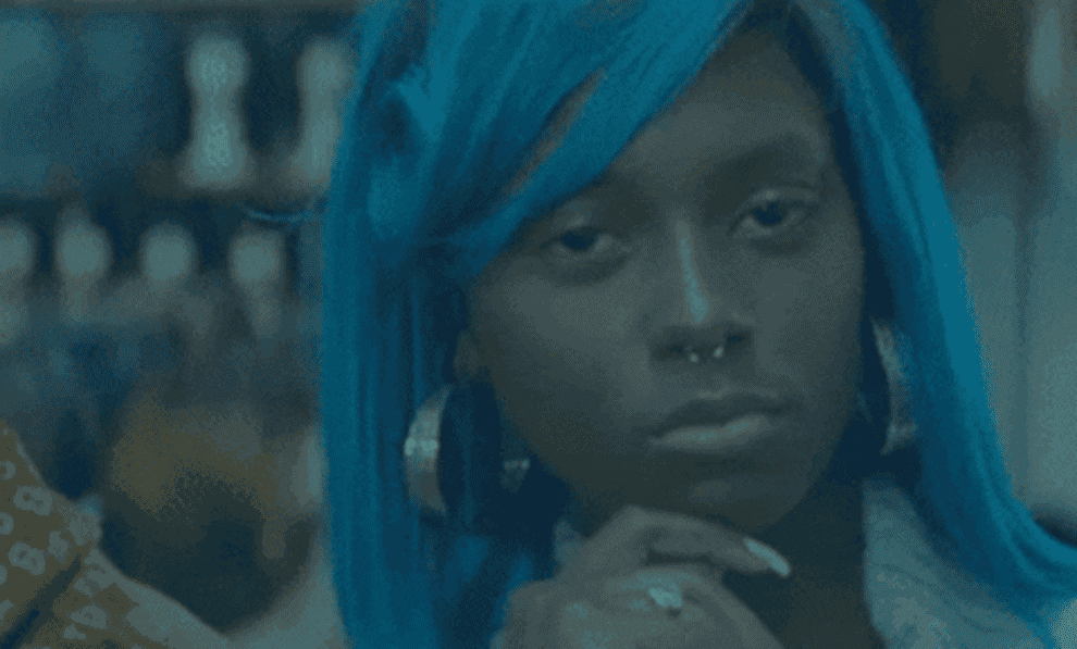GIF of a woman with blue hair.