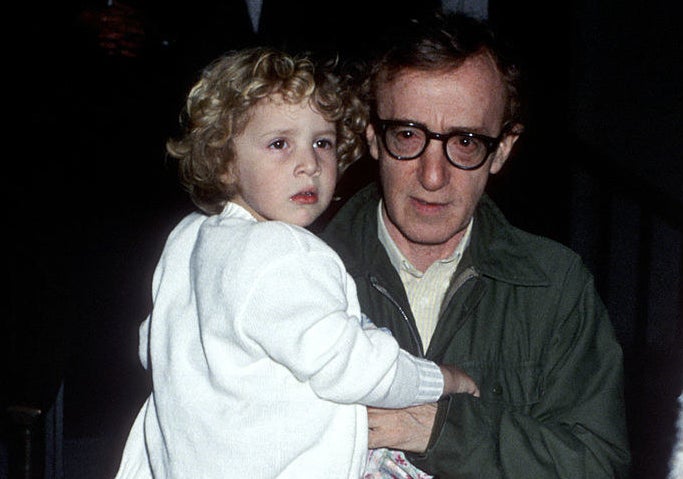 Woody Allen carrying a baby Dylan