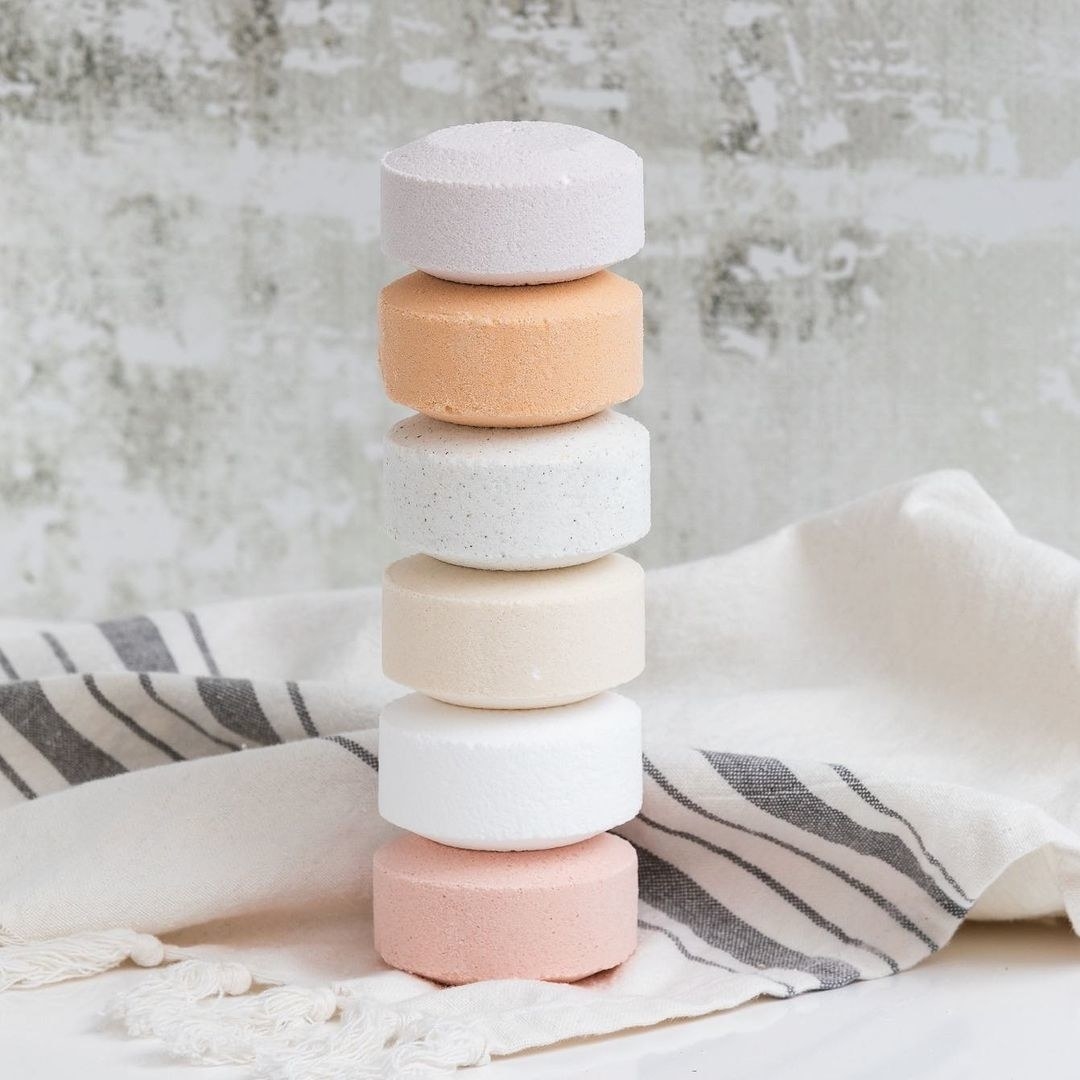 A stack of the shower tablets on a turkish towel