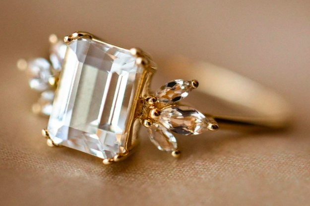 white topaz ring with three teardrop stones on each side
