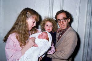 Mia Farrow holding baby Ronan while Woody is holding baby Dylan