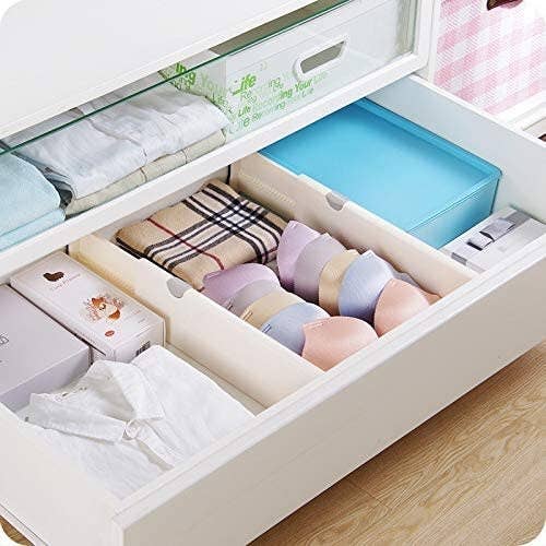 the dividers in a drawer separating clothes