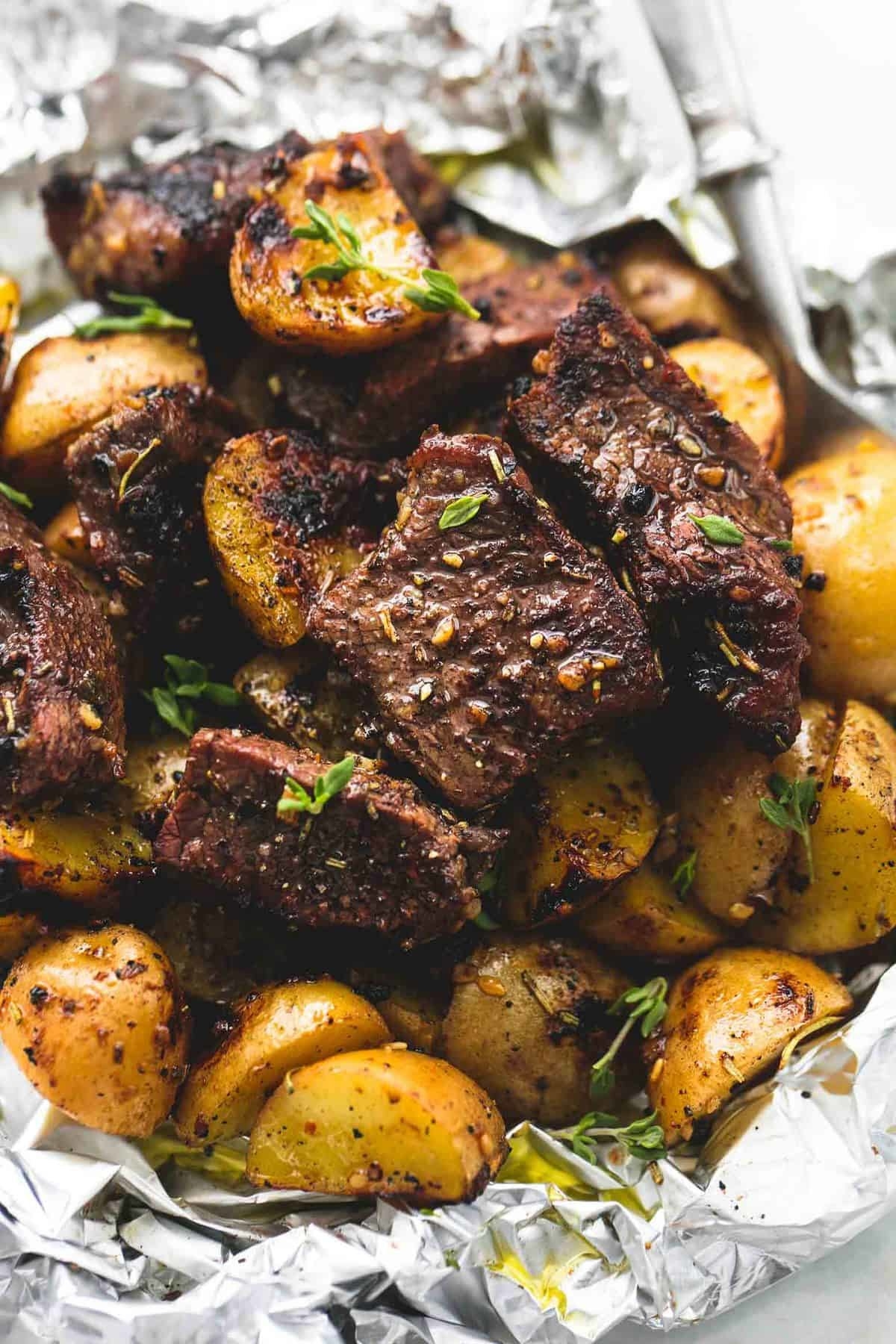 Steak and potatoes in foil