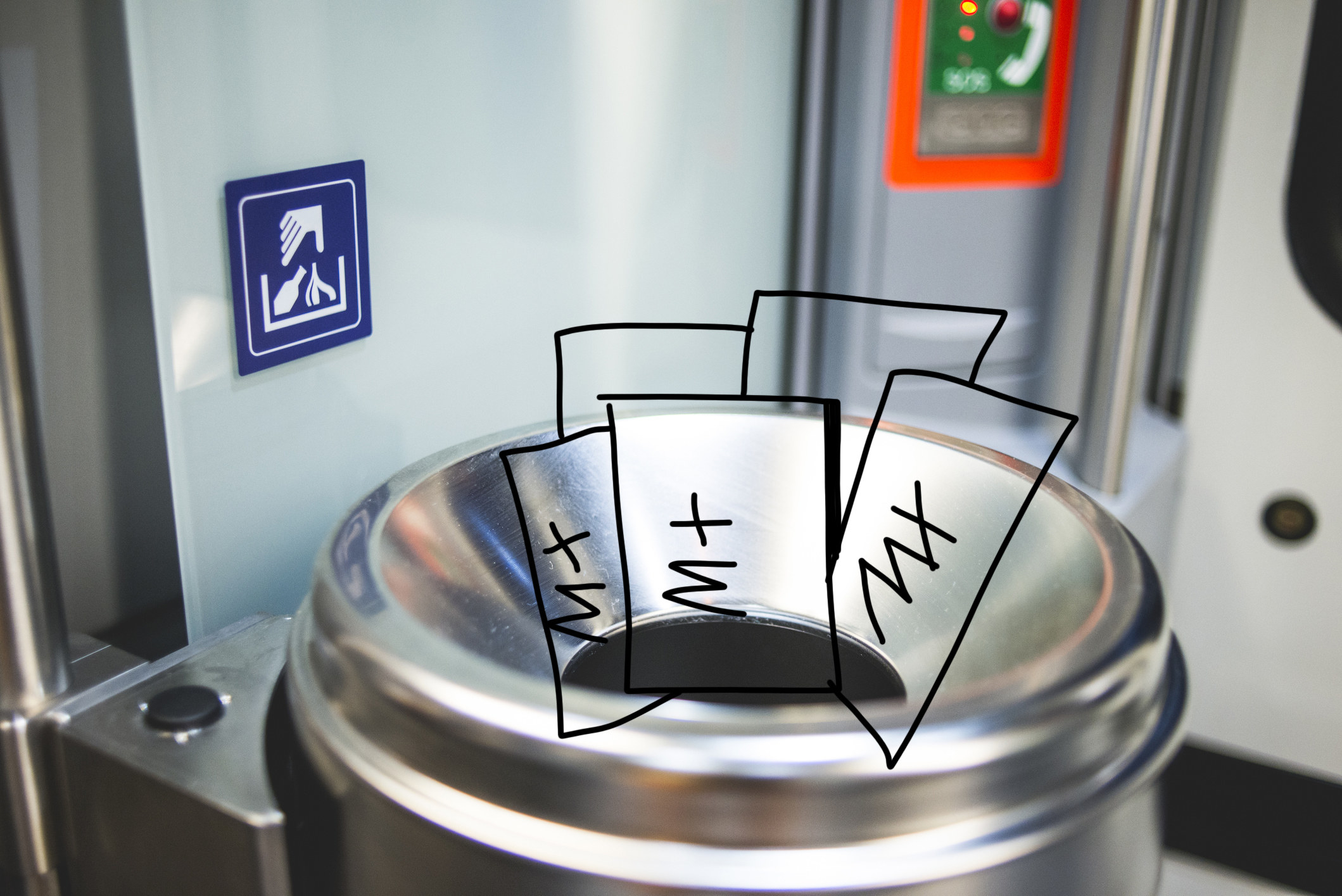 A stock photo of a bin at a train station with mX newspapers drawn in 