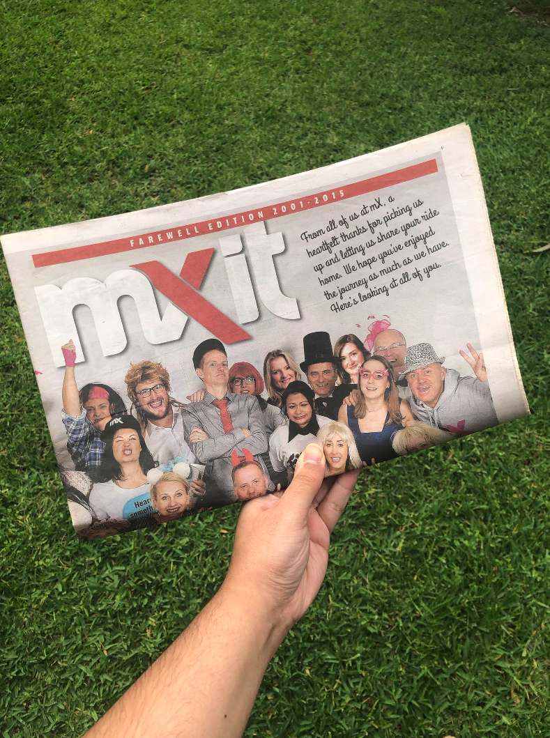 A hand holding mX&#x27;s final edition 