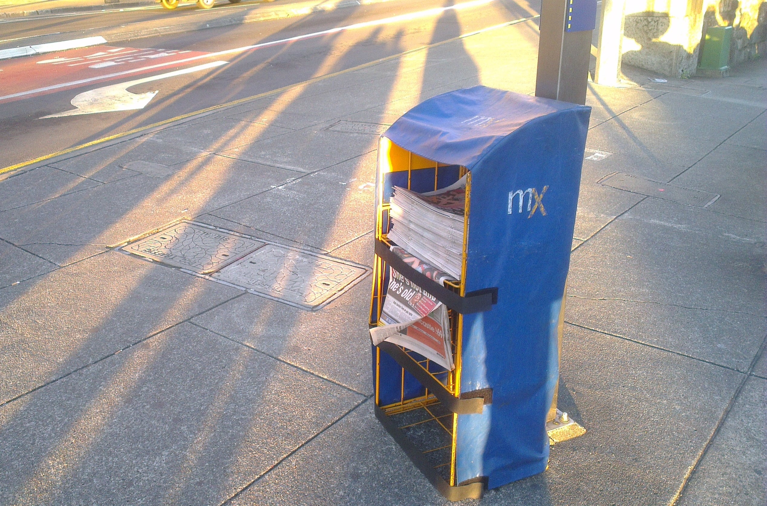 An mX newspaper dispenser on the street