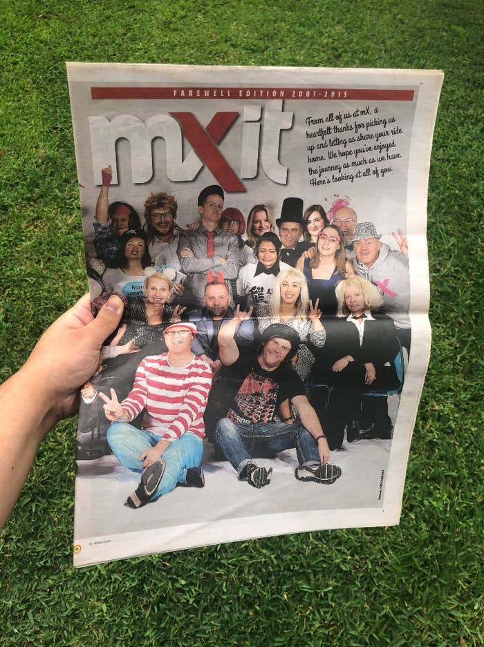 A hand holding an edition of mX