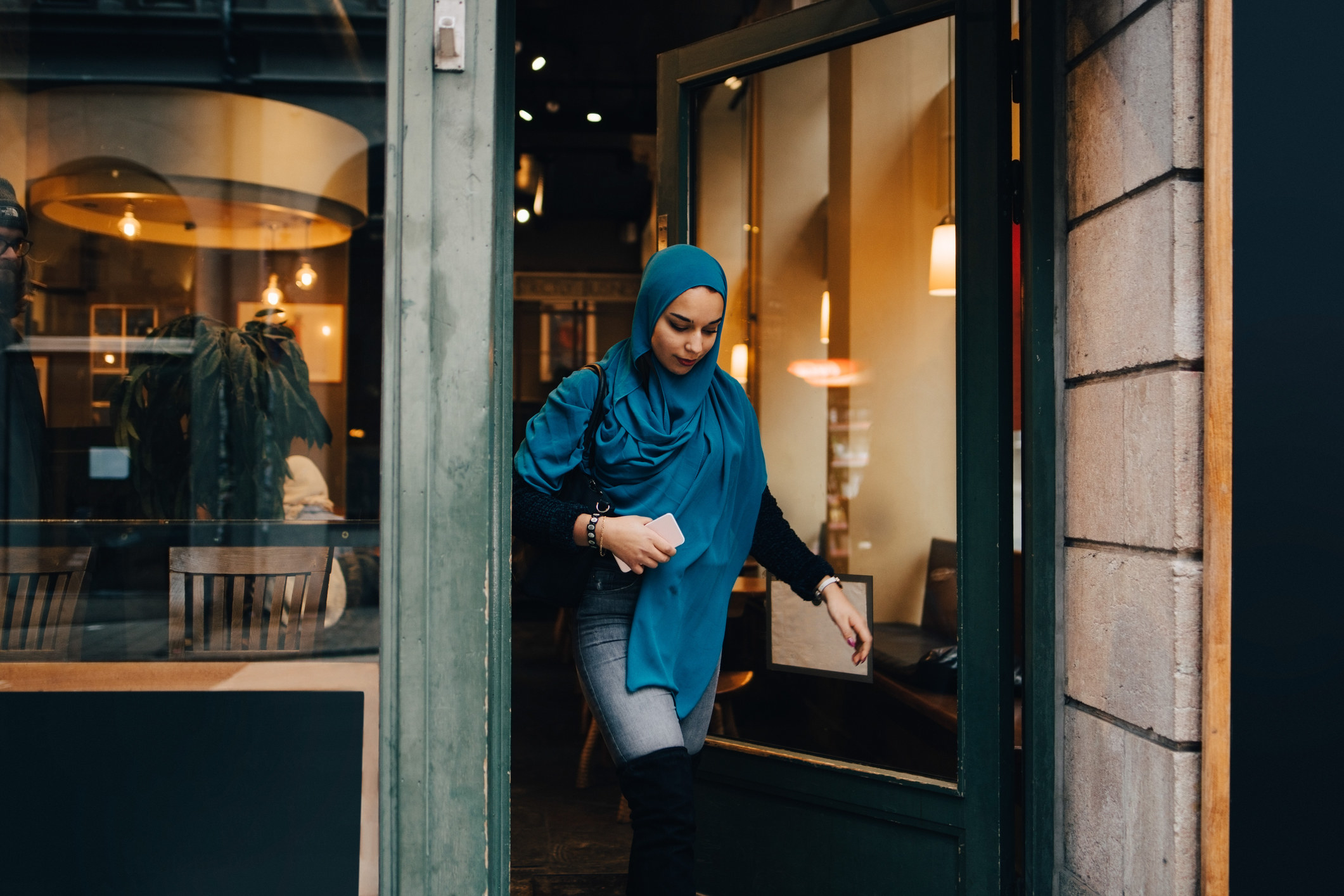 A woman leaving a store empty-handed 