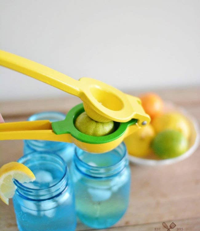 a yellow and green lemon squeezer