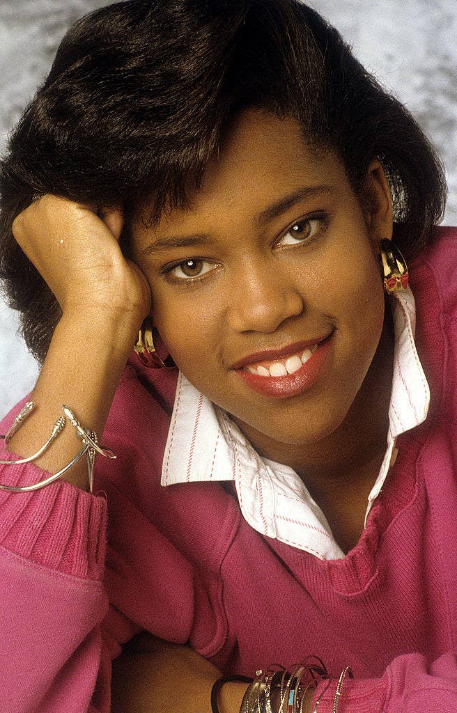 Regina King posing for a portrait in a sweater and collared shirt, late 1980s