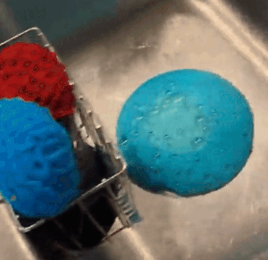 A customer review gif of them using the disposal cleaner in their sink 