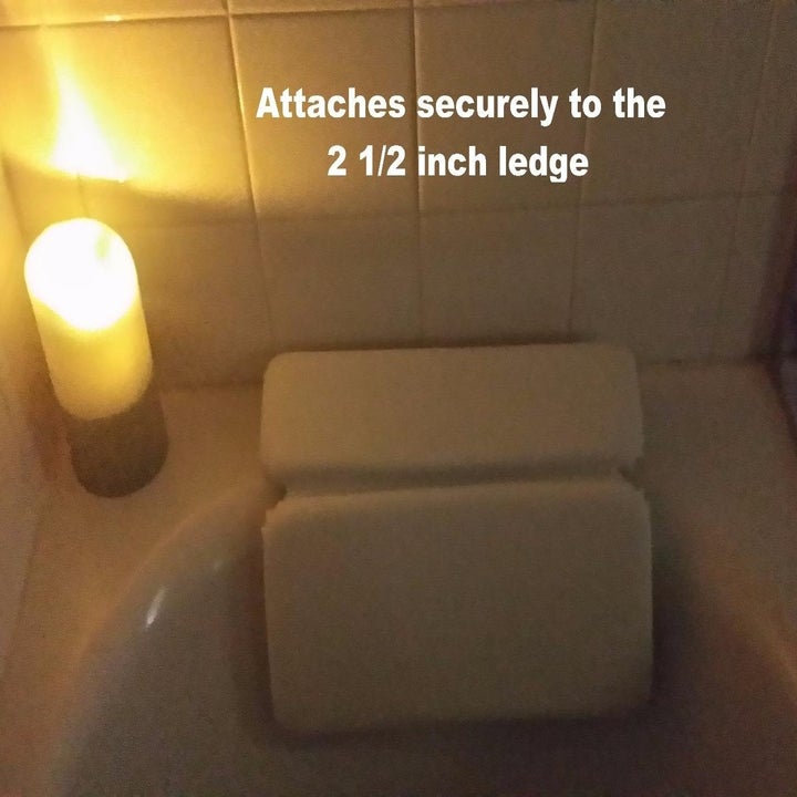 Reviewer image of the pillow with text: "Attaches securely to the 2 1/2 inch ledge"