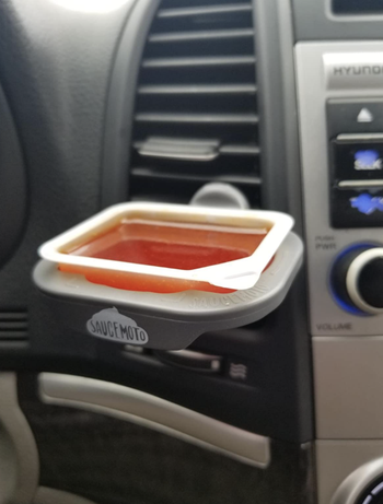 sauce dip clip mounted on an air vent 