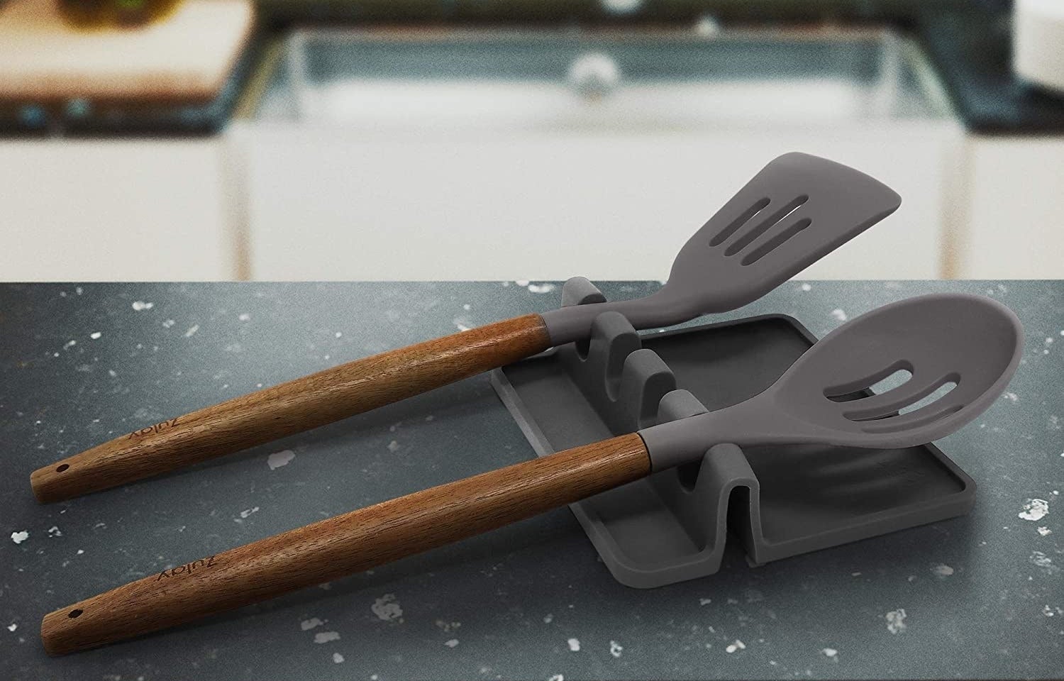 a spatula and a slotted spoon on the holder