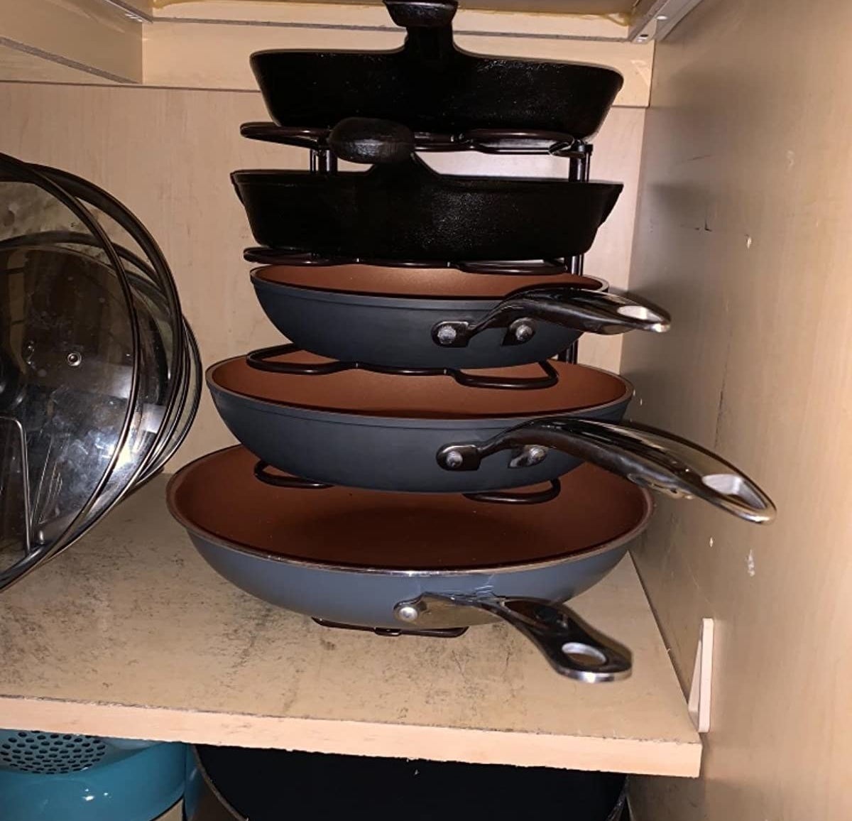 reviewer photo showing their pots and pans neatly stacked on the organizer