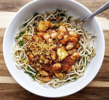 bowl of pasta with beans, bread crumbs, and zucchini on top
