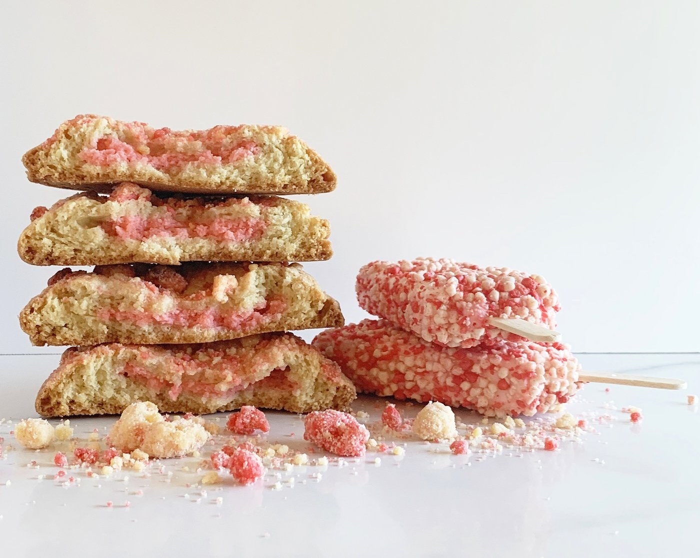 vanilla cookies with pink centers and pink and white crumble on top 