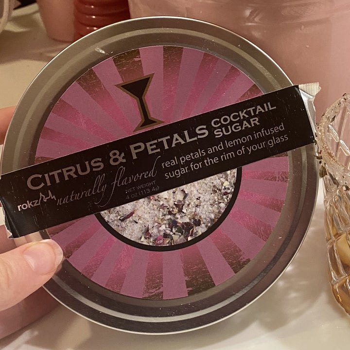 A container of citrus petals rim sugar 