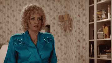 A GIF of someone with a perm
