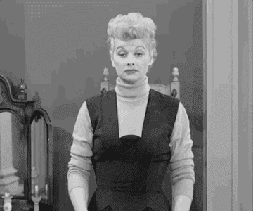 gif of lucy from &quot;I Love Lucy&quot; making a gesture showing she isn&#x27;t bothered 