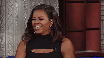 Michelle Obama nodding and smiling