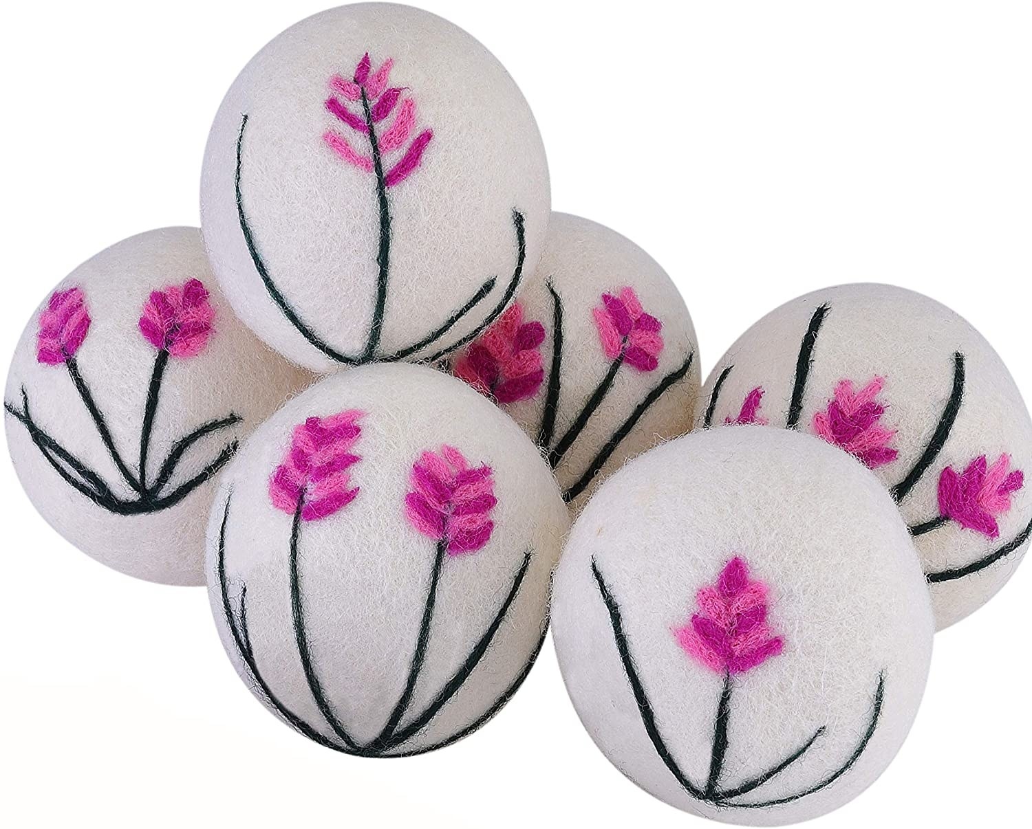 the white wool dryer balls with embroidered flowers on them