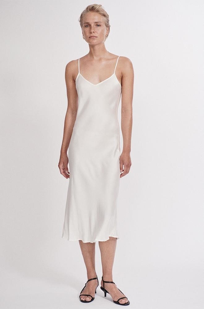 model wearing the white strappy silk dress 