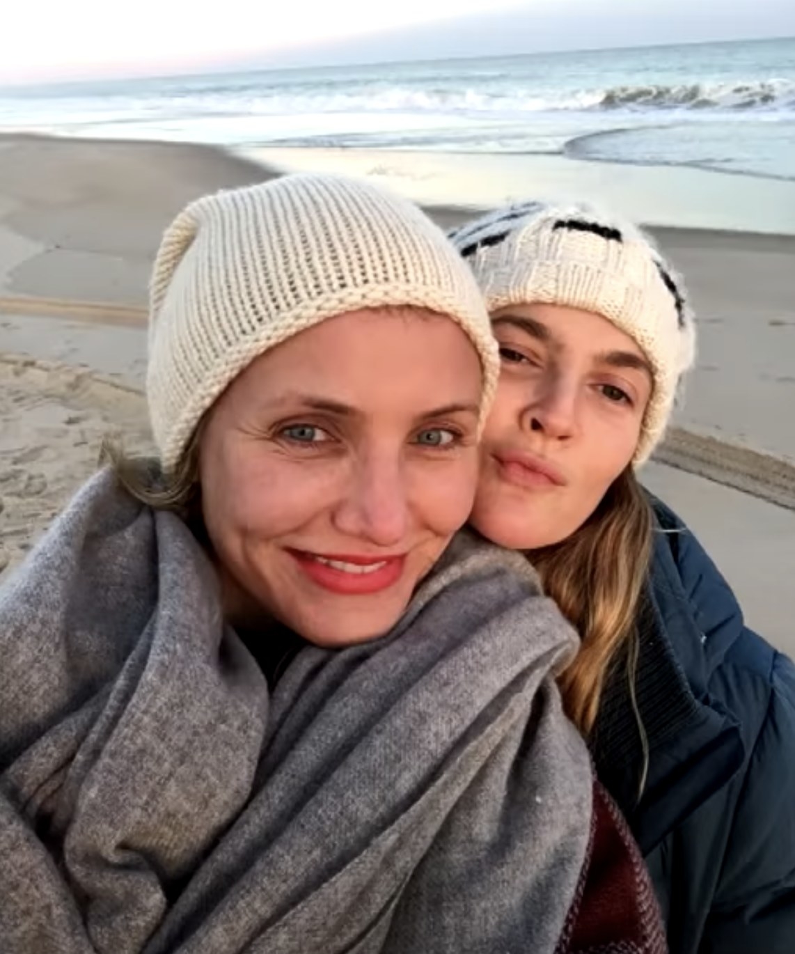 Drew and Cameron bundle up while at the beach