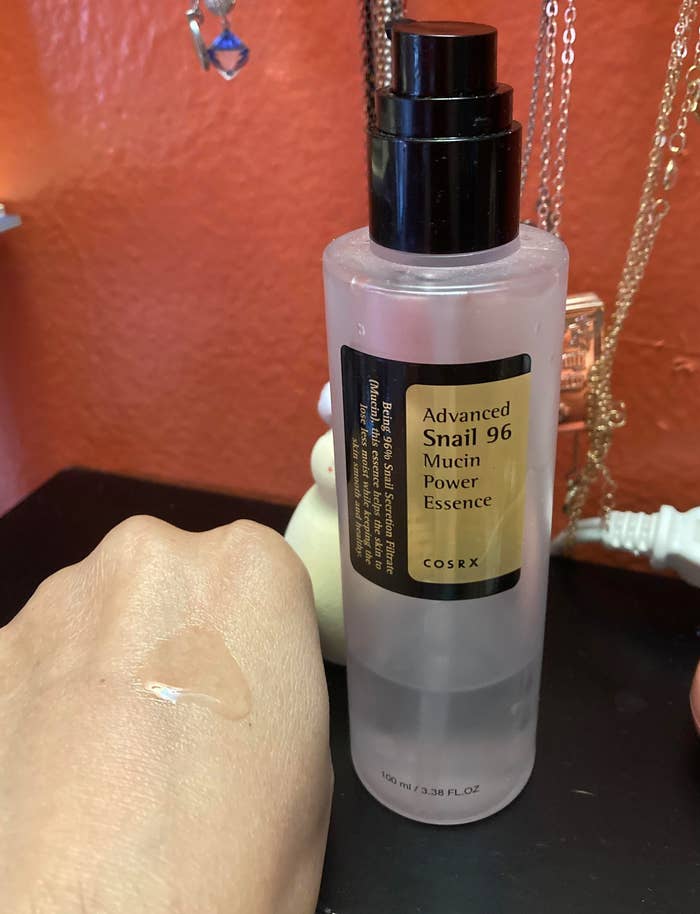 the bottle with swatch of the liquid texture on hand