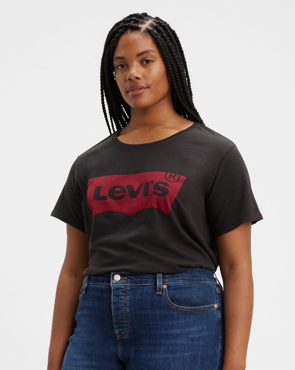 model wearing a black t-shirt with a red levi&#x27;s logo