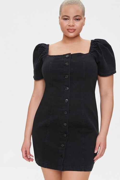 Model wearing the denim mini dress in black