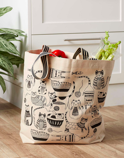 A canvas tote covered in cat doodles