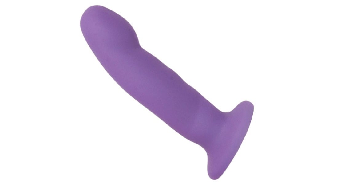 A strap-on dildo in purple