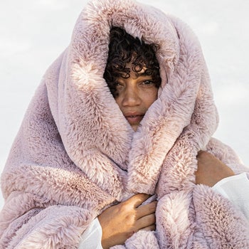 Person with plush blanket wrapped around their head
