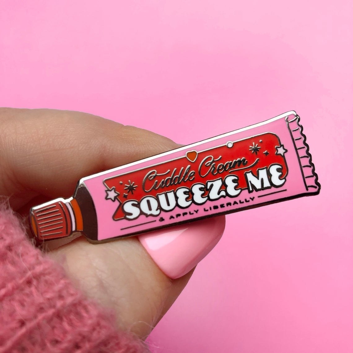 Tube shaped pin with words &quot;Cuddle Cream Squeeze Me &amp;amp; Apply Liberally&quot; 