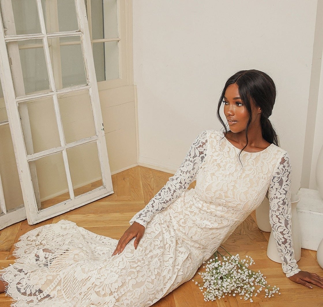 model wearing the sleeved lace dress